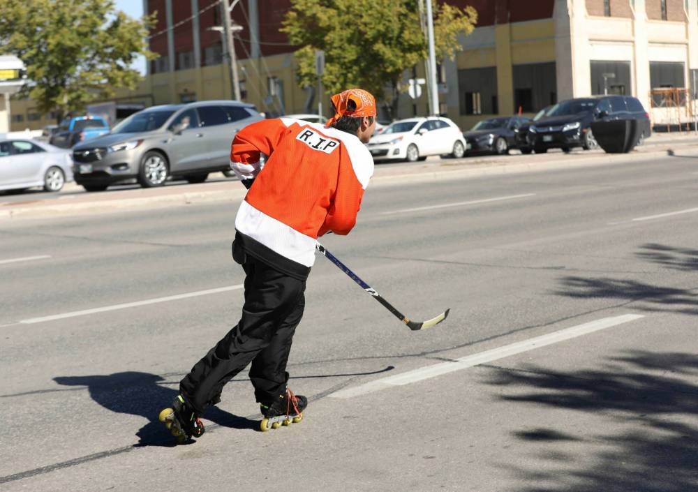 RUTH BONNEVILLE / WINNIPEG FREE PRESS
As public awareness grows, Alan Young wanted to pay his respects to those who survived, those who didn’t, and those who still feel the effect of residential schools by wearing orange, while simultaneously crafting another narrative.