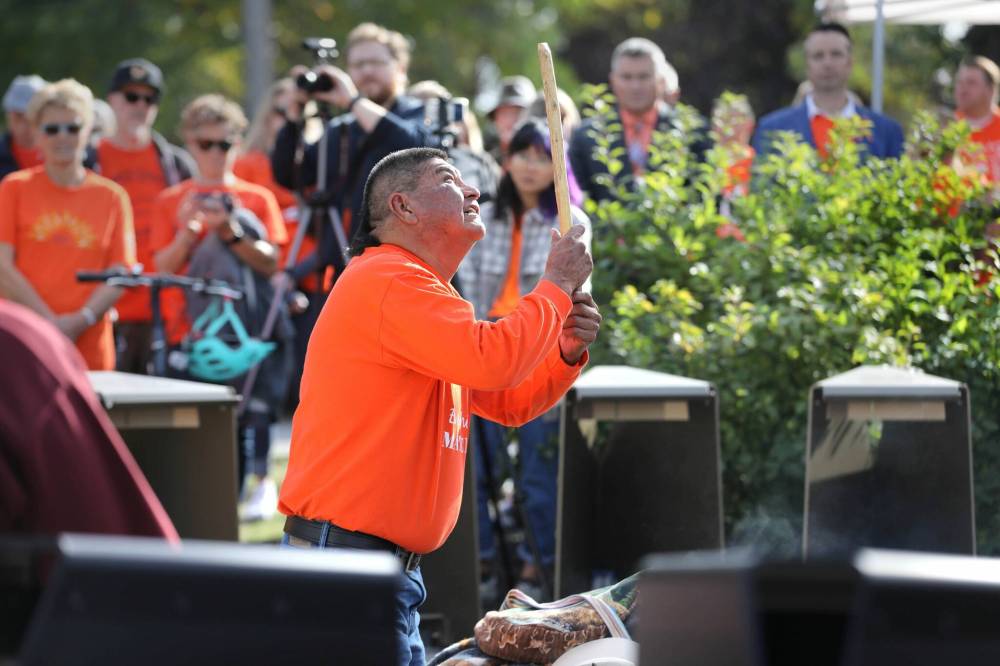 RUTH BONNEVILLE / WINNIPEG FREE PRESS
Sheldon Cote performs a pipe ceremony at the official opening of the Assiniboia Residential School commemorative monument and gathering place Friday.