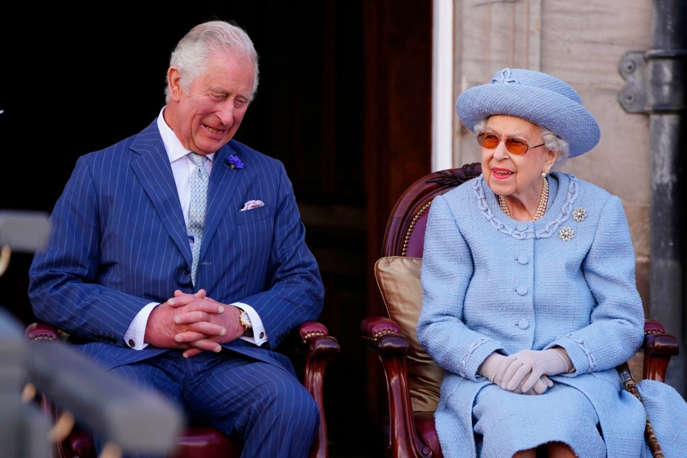 Britain's Queen Elizabeth II and Prince Charles, known as the Duke of Rothesay when in Scotland, attending the Queen's Body Guard for Scotland (also known as the Royal Company of Archers) Reddendo Parade in the gardens of the Palace of Holyroodhouse, Edinburgh last month. (Jane Barlow / Pool via AP)