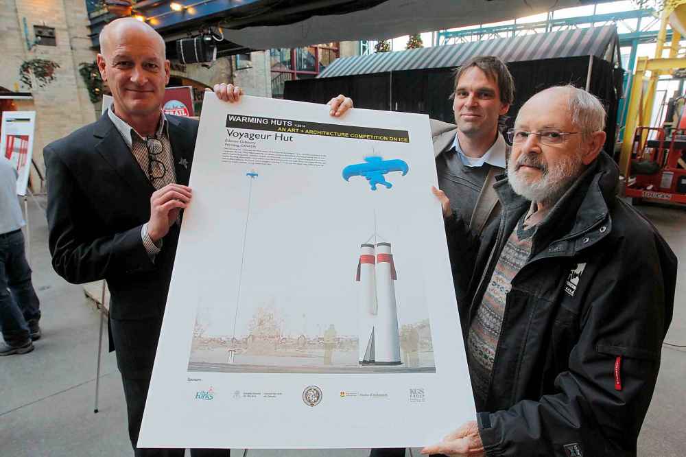 In 2013, Gaboury (right) holds his winning design for a warming hut at The Forks. Gaboury designed the Voyageur Hut, a large pair of voyageur pants (complete with leg sashes) held upside-down by a large blue helium balloon shaped like a voyageur carrying a canoe on his head. (Boris Minkevich / Winnipeg Free Press files)