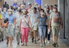 People wear face masks as they walk through a subway station in Montreal, Sunday, July 17, 2022, as the COVID-19 pandemic continues in the province. The number of hospitalizations linked to COVID-19 in Quebec has risen above 2,000 for the first time since mid-August. THE CANADIAN PRESS/Graham Hughes