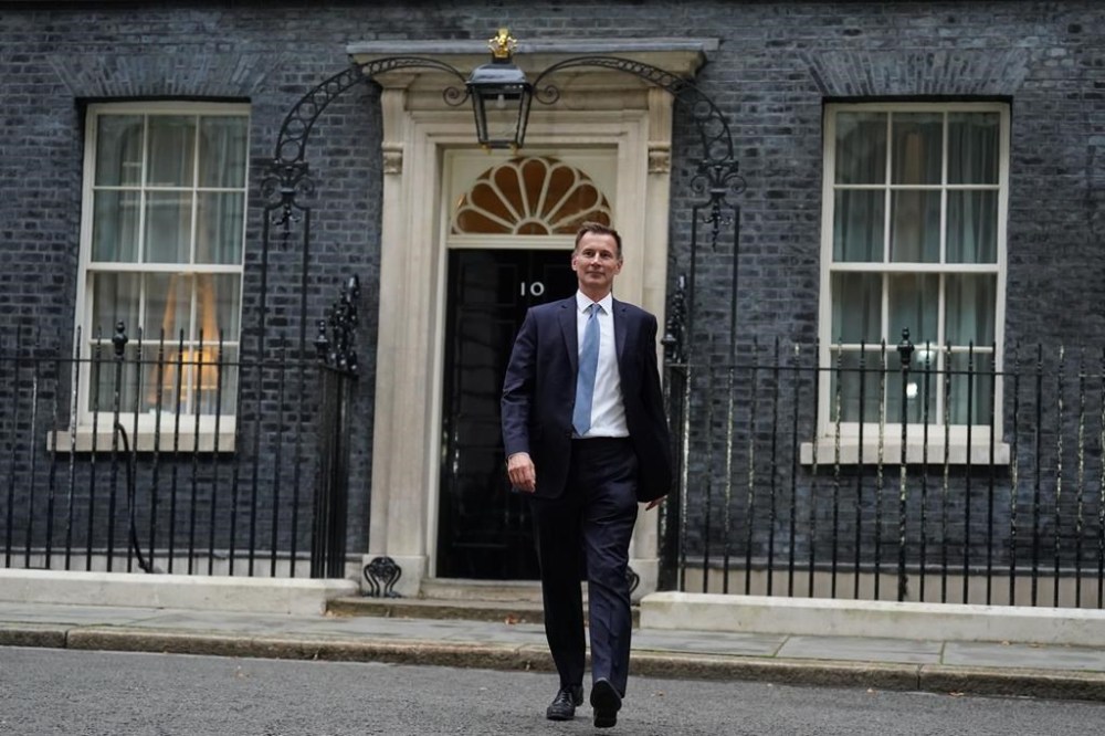 Jeremy Hunt leaves 10 Downing Street in London after he was appointed Chancellor of the Exchequer following the resignation of Kwasi Kwarteng, Friday Oct. 14, 2022. Chancellor of the Exchequer Kwasi Kwarteng said he has accepted Prime Minister Liz Truss' request he