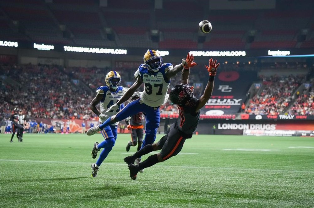 B.C. Lions' Keon Hatcher (4) fails to make the reception in the end zone as Winnipeg Blue Bombers' Brandon Alexander (37) defends during the first half of CFL football game in Vancouver, on Saturday, October 15, 2022. THE CANADIAN PRESS/Darryl Dyck