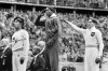 FILE - In this Aug. 11, 1936, file photo, America's Jesse Owens, center, salutes during the presentation of his gold medal for the long jump, alongside silver medalist Luz Long, right, of Germany, and bronze medalist Naoto Tajima, of Japan, during the 1936 Summer Olympics in Berlin. The silver medal captured by Luz Long, the German long jumper who befriended Jesse Owens at the 1936 Olympics in Berlin, sold at auction for $488,000, a sum the auction house said was a record price for a publicly sold second-place prize. (AP Photo/File)