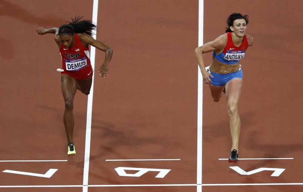 FILE - Russia's Natalya Antyukh, right, powers ahead of United States' Lashinda Demus to win gold in the women's 400-meter hurdles final during the athletics in the Olympic Stadium at the 2012 Summer Olympics, London, Wednesday, Aug. 8, 2012. Russian runner Natalya Antyukh was disqualified on Monday, Oct. 24, 2022 from her 400-meter hurdles win at the 2012 London Olympics for doping, and Lashinda Demus of the United States is set to be upgraded to the gold medal. (AP Photo/Daniel Ochoa De Olza, File)