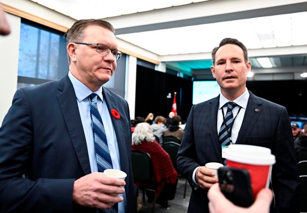 Freedom Convoy organizer Tom Marazzo and lawyer Keith Wilson, speak to people in the gallery before the start of the day's hearings at the Public Order Emergency Commission where they will appear as witnesses, in Ottawa, on Wednesday, Nov. 2, 2022. THE CANADIAN PRESS/Justin Tang