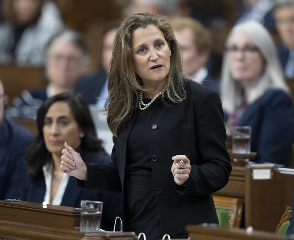 Deputy Prime Minister and Finance Minister Chrystia Freeland rises during question period, in Ottawa, Monday, Sept. 26, 2022. Finance Minister Chrystia Freeland will table her mid-year budget update in the House of Commons today focused heavily on driving investment to Canada's clean energy industries in response to new American tax incentives signed into law last summer. THE CANADIAN PRESS/Adrian Wyld