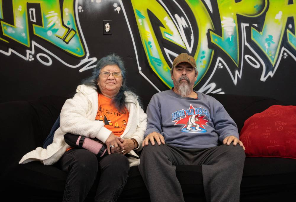 JESSICA LEE / WINNIPEG FREE PRESS
Wayne’s parents, Agnes Catcheway (in orange and white) and Wayne Ross (beside her) at the grand opening of Wayne’s World Youth Lounge in Turtle Island Neighbourhood Centre.