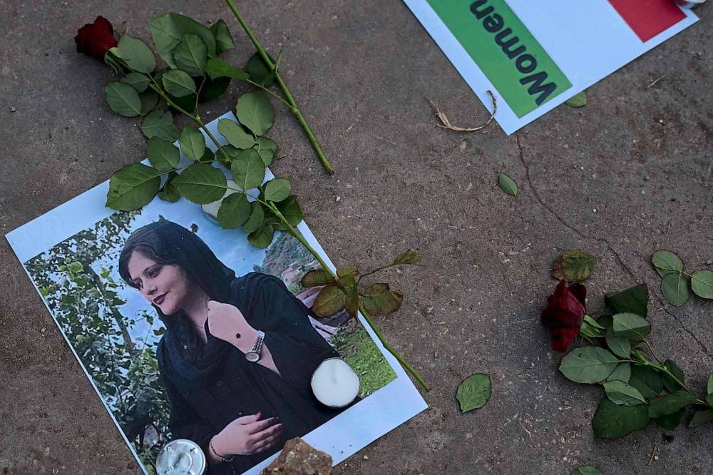 MAYA ALLERUZZO / THE ASSOCIATED PRESS FILES
A photo depicting Mahsa Amini, a young Iranian woman who died after being arrested in Tehran by Iran’s notorious “morality police”.