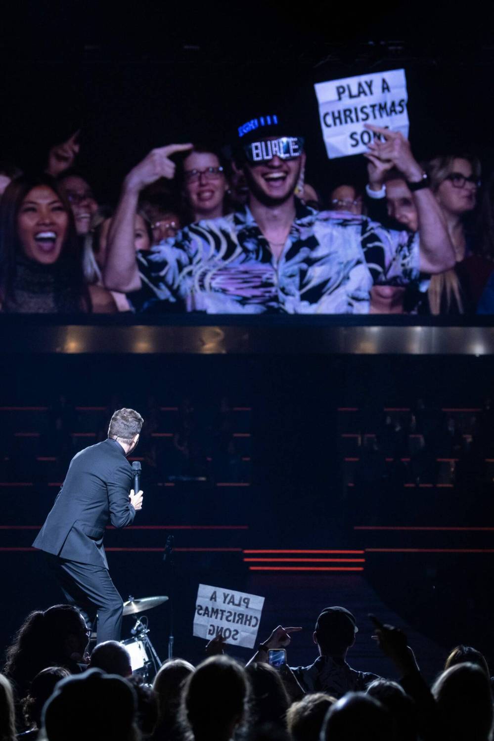 Matt Duboff / Winnipeg Free Press
Never one to miss out on engaging with the audience, Bublé cheers an audience member’s novelty sunglasses.