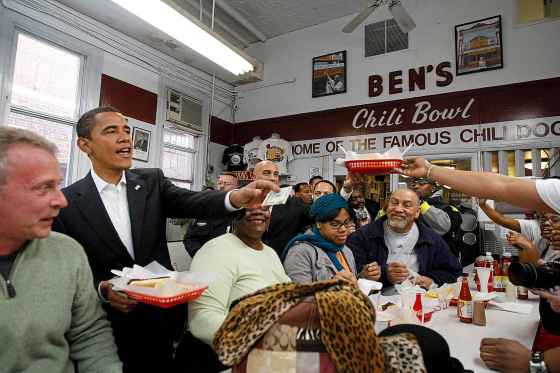 In this 2009 photo, then-president Barack Obama stops at Ben’s Chili Bowl in Washington, D.C. The half-smoke is one of Ben’s specialties. (Gerald Herbert / The Associated Press files)