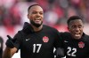 Canada's Cyle Larin, 17, celebrates his goal against the USA with teammate Richie Laryea, 22, during a men's first half World Cup Qualifier at in Hamilton, Ont. on Sunday Jan. 30, 2022. While Canada turned heads in topping World Cup qualifying run in the CONCACAF region, the competition in Qatar is next-level. THE CANADIAN PRESS/Nathan Denette