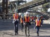 Prime Minister Justin Trudeau arrives with Rio Tinto chief executive Jakob Stausholm, left, and Industry Minister Francois-Philippe Champagne, right, for a tour of a new pilot project for a blue smelting facility at the Rio Tinto plant, on Tuesday, Oct. 11, 2022 in Sorel, Que. THE CANADIAN PRESS/Ryan Remiorz
