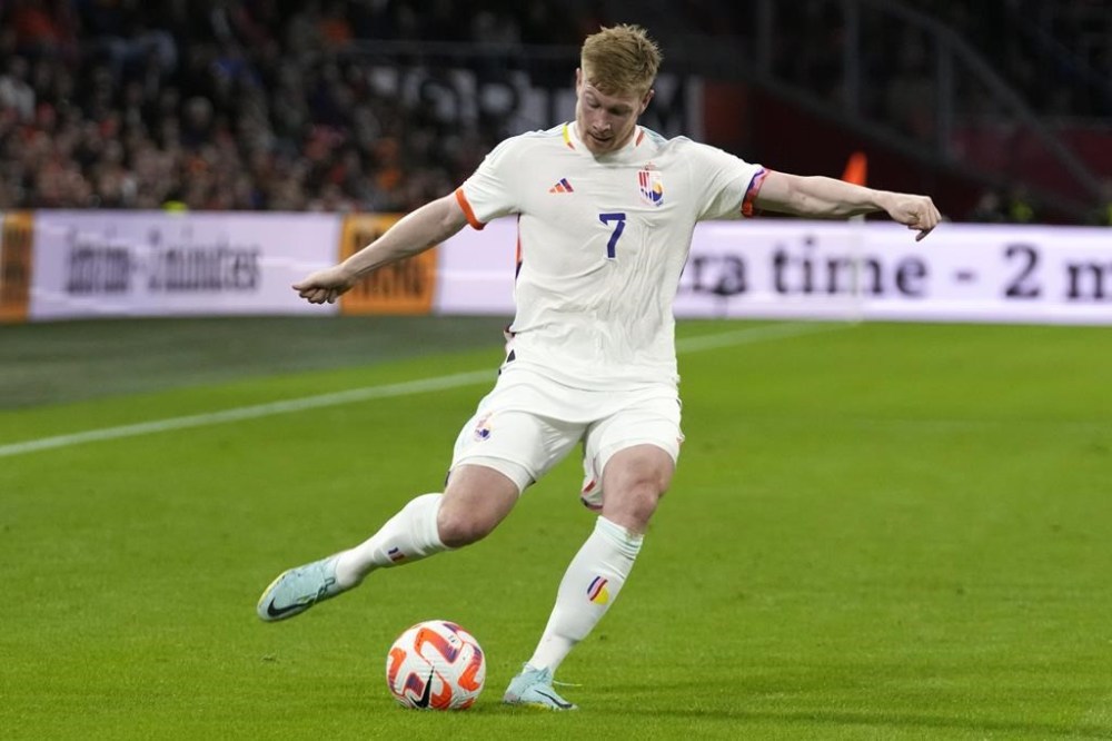 FILE - Belgium's Kevin De Bruyne during the UEFA Nations League soccer match between the Netherlands and Belgium at the Johan Cruyff ArenA in Amsterdam, Netherlands, on Sept. 25, 2022. FIFA has denied Belgium's request to wear team jerseys with a 'Love' label at the World Cup in Qatar. The Belgian soccer federations says the ruling was because of a commercial link to Belgium's signature dance music festival Tomorrowland. Multi-color detail on the white shirt had been described as a