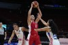 Canada's Natalie Achonwa, centre, looks to pass the ball past Puerto Rico's Isalys Quinones during their quarterfinal game at the women's Basketball World Cup in Sydney, Australia, Thursday, Sept. 29, 2022. Achonwa has announced she is pregnant. THE CANADIAN PRESS/AP-Mark Baker