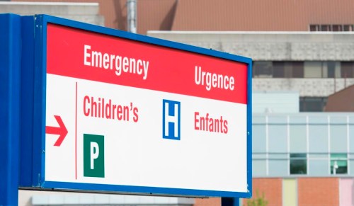 A sign directing visitors to the emergency department is shown at CHEO, Friday, May 15, 2015 in Ottawa. Ontario has asked thousands of family health-care workers to work evenings and weekends to help ease the burden on overwhelmed children's hospitals.THE CANADIAN PRESS/Adrian Wyld