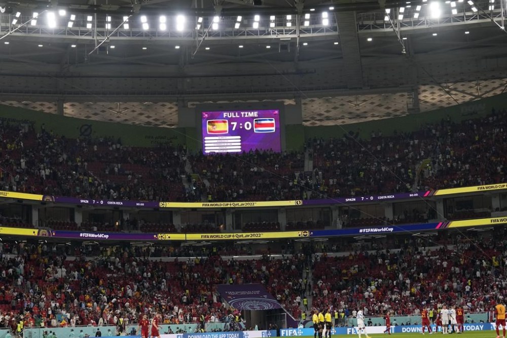 The screen shows the final score of the World Cup group E soccer match between Spain and Costa Rica, at the Al Thumama Stadium in Doha, Qatar, Wednesday, Nov. 23, 2022. (AP Photo/Alessandra Tarantino)