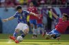 Costa Rica's Yeltsin Tejeda, right, tries to block a shot from Japan's Wataru Endo during the World Cup, group E soccer match between Japan and Costa Rica, at the Ahmad Bin Ali Stadium in Al Rayyan , Qatar, Sunday, Nov. 27, 2022. (AP Photo/Ariel Schalit)