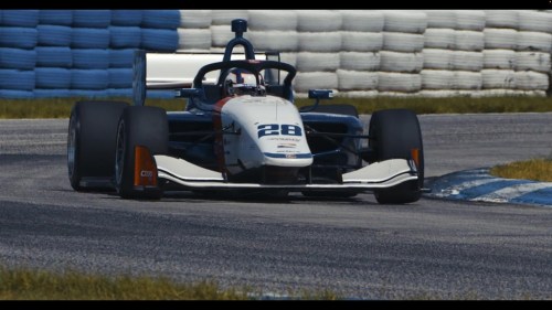 This photo provided by Andretti Autosport shows British racer Jamie Chadwick testing an INDY NXT car on the road course at Indianapolis Motor Speedway, Oct. 21, 2021. Three-time W Series champion Jamie Chadwick has finally parlayed her success into a bigger ride. (Andretti Autosport via AP)