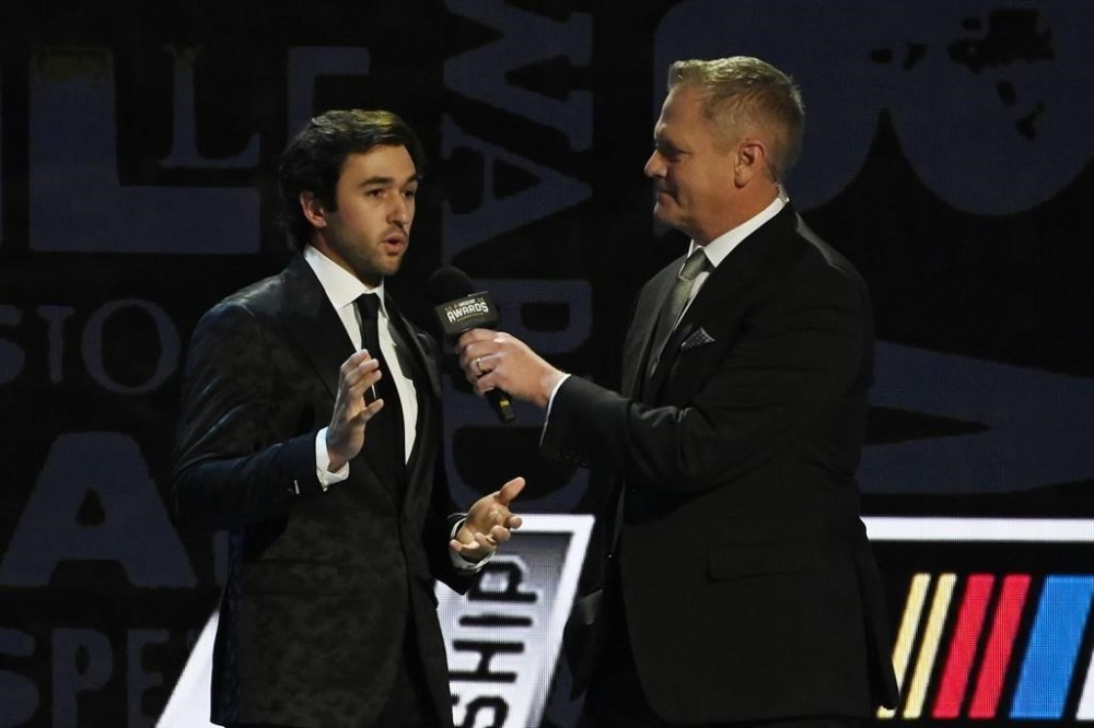 NASCAR fan favorite Chase Elliott, left, speaks during the NASCAR Awards on Thursday, Dec. 1, 2022, in Nashville, Tenn. (AP Photo/Mark Zaleski)