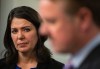 Alberta Premier Danielle Smith watches Minister of Justice and Solicitor General of Alberta Tyler Shandro speak at a press conference after the throne speech in Edmonton, on Tuesday, Nov. 29, 2022. THE CANADIAN PRESS/Jason Franson
