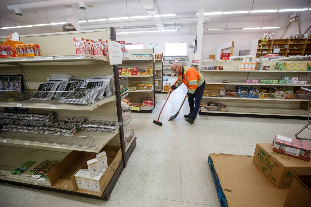 MIKE DEAL / WINNIPEG FREE PRESS
Vandals have thrown rocks through Tsang's windows several times over the past three years.