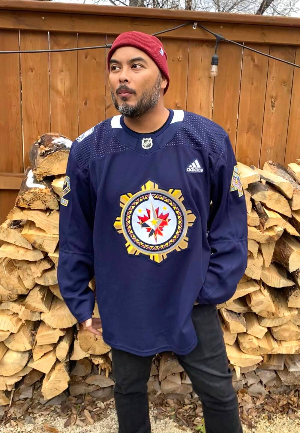 SUPPLIED
Jonato Dalayoan wears the Winnipeg Jets warm-up jersey he designed for the inaug- ural Winnipeg Jets Filipino Heritage Night.