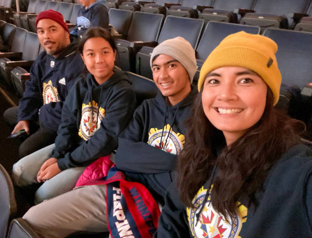 SUPPLIED
Jonato Dalayoan (from left) with children Nova, 12, Josiah, 14, and wife Marie Miller-Dalayoan at the inaugural Winnipeg Jets Filipino Heritage Night.