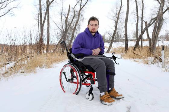 While he’s eager to get back on his sled, Ethan Christie advises those who are riding on and off trails this winter to slow down, ride with others and wear a quality helmet. (Ruth Bonneville / Winnipeg Free Press)