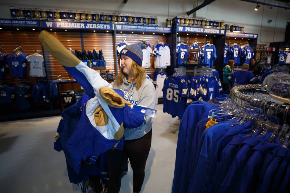 MIKE DEAL / WINNIPEG FREE PRESS
“I’m very excited. It’s going to be an awesome experience,” Alex Slough said while shopping at the Bomber Store.
