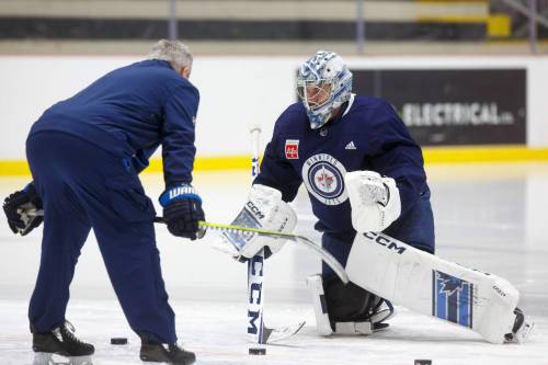 MIKE DEAL / WINNIPEG FREE PRESS
                                Winnipeg Jets&rsquo; goaltender David Rittich works on a drill with assistant coach Wade Flaherty Tuesday during practice.