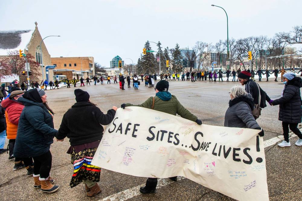 The public demonstration came after the Manitoba Harm Reduction Network held a week-long conference in the city with more than 400 people in attendance. (Mikaela MacKenzie / Winnipeg Free Press)