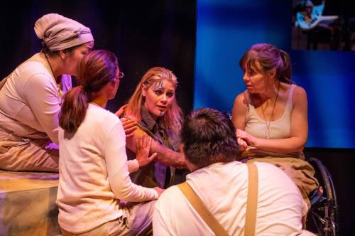 SICK + TWISTED THEATRE
                                Antigone (Sarah Luby, centre) is surrounded by the chorus as she is sentenced to death.