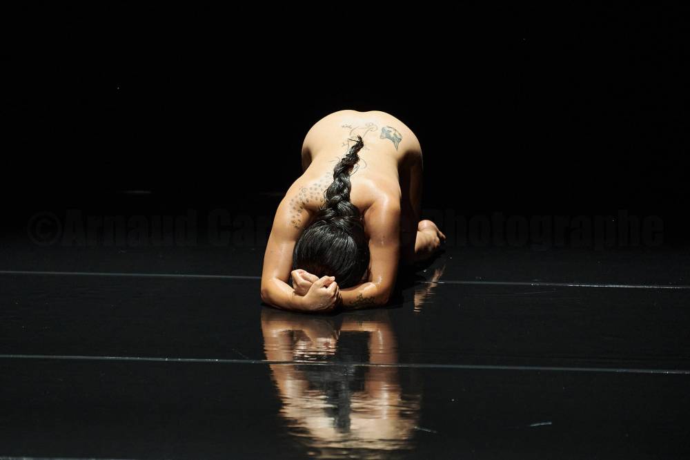IAN DOUGLAS PHOTO
Irene Martinez slithers, slides and crawls across an oiled stage in Serpentine.
