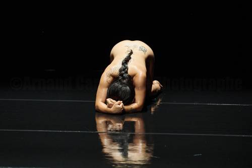IAN DOUGLAS PHOTO
                                Irene Martinez slithers, slides and crawls across an oiled stage in Serpentine.