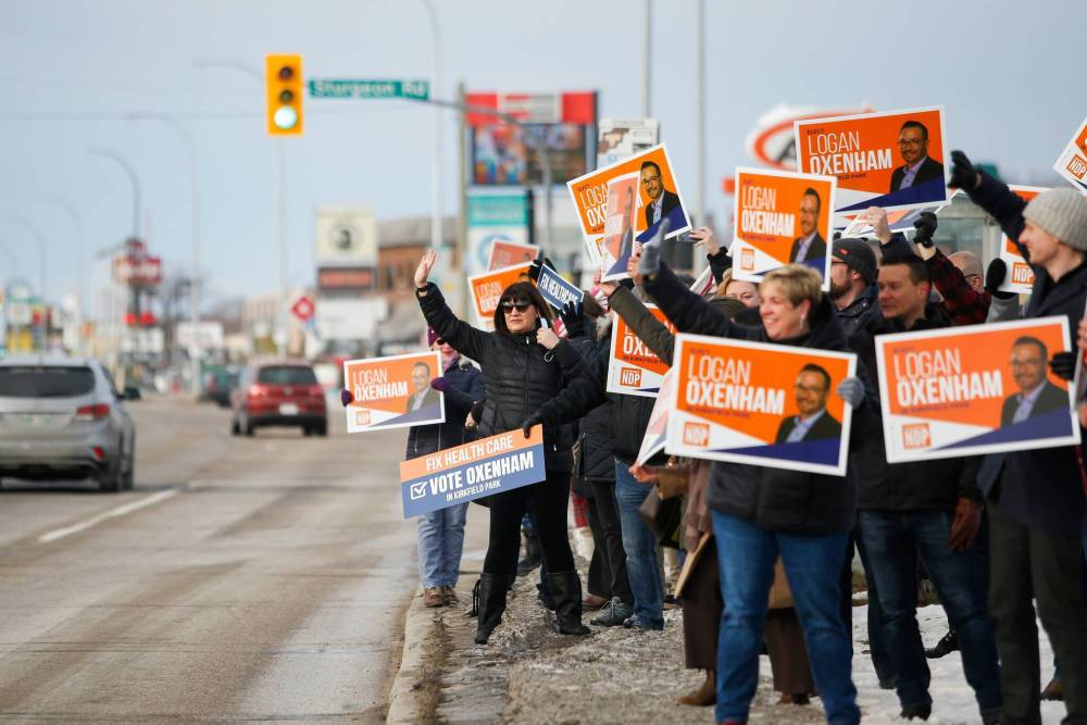 JOHN WOODS / WINNIPEG FREE PRESS
NDP supporters gather outside the Grace Hospital in support of health care and their candidate in Kirkfield Park, Logan Oxenham, Sunday.