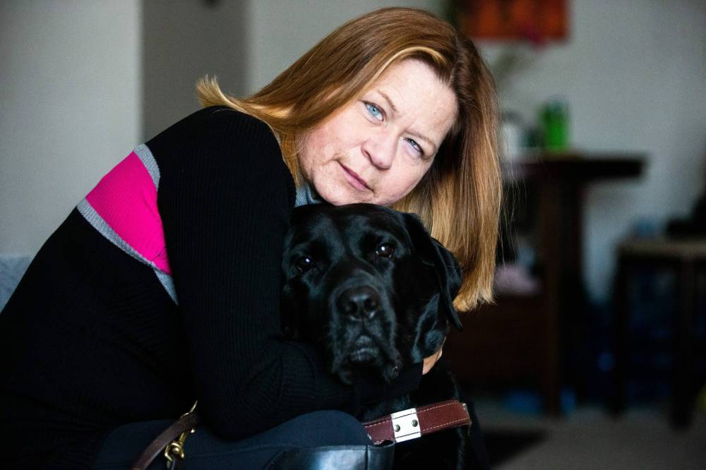 Veronika Kanya and her guide dog, Apache. (Mikaela MacKenzie / Winnipeg Free Press)