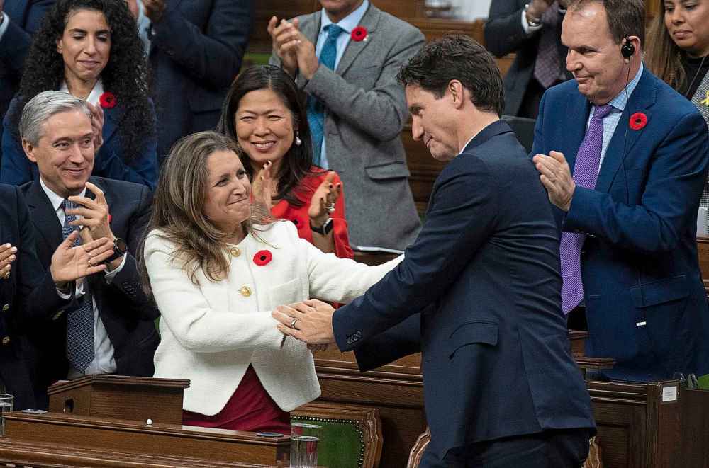Deputy Prime Minister and Finance Minister Chrystia Freeland is congratulated by Prime Minister Justin Trudeau after delivering the fiscal update in the House of Commons, in Ottawa, Thursday, Nov. 3, 2022. THE CANADIAN PRESS/Adrian Wyld