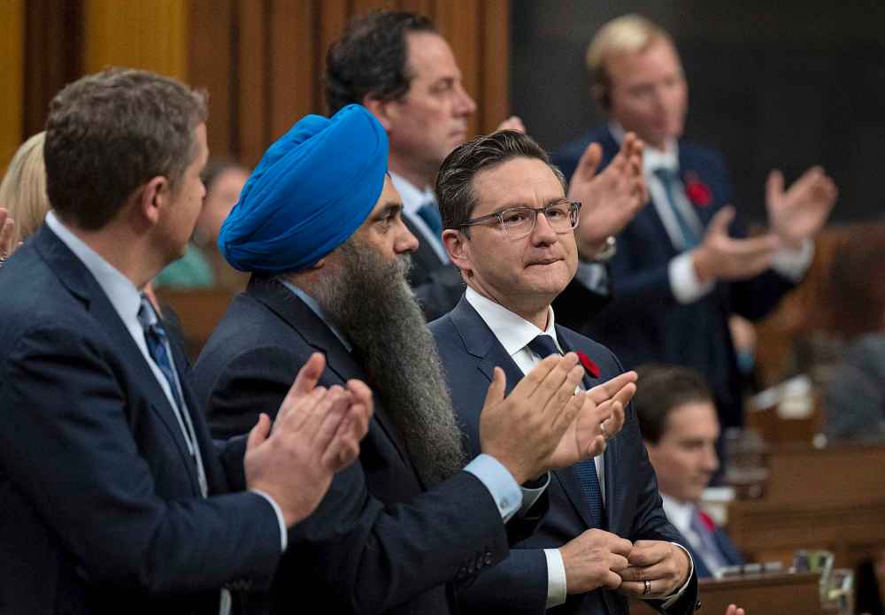 Conservative members applaud Leader Pierre Poilievre as he speaks following the fall economic statement in the House of Commons, in Ottawa, Thursday, Nov. 3, 2022. THE CANADIAN PRESS/Adrian Wyld