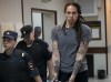 FILE - WNBA star and two-time Olympic gold medalist Brittney Griner is escorted from a courtroom after a hearing in Khimki just outside Moscow, Russia, on Aug. 4, 2022. WNBA star Brittney Griner, is the focus of efforts by the United States to arrange a prisoner swap with Russia. The Associated Press and other news organizations have reported that Washington has offered to exchange Griner and Whelan for Viktor Bout, a Russian arms dealer who is serving a 25-year sentence in the U.S. and once earned the nickname the 
