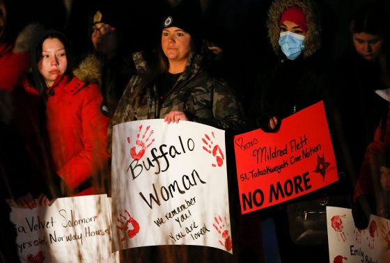 People gathered at the Oodena Circle at The Forks for a vigil to name and remember victims of alleged serial killer. (John Woods / Winnipeg Free Press)