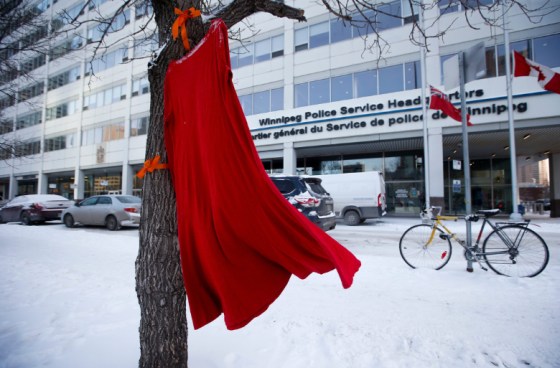 A red dress sways in the wind outside the Winnipeg Police Service headquarters. (John Woods / Winnipeg Free Press)