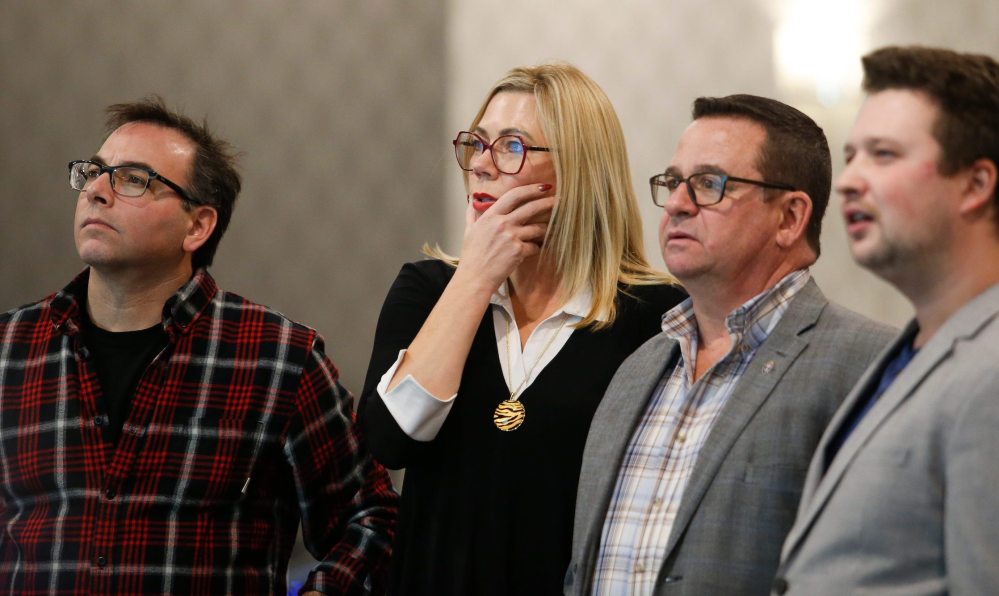 JOHN WOODS / WINNIPEG FREE PRESS
People watch as results come in at the PC headquarters Tuesday. It took Elections Manitoba more than an hour to announce results of the final four polls, which were the advance votes.