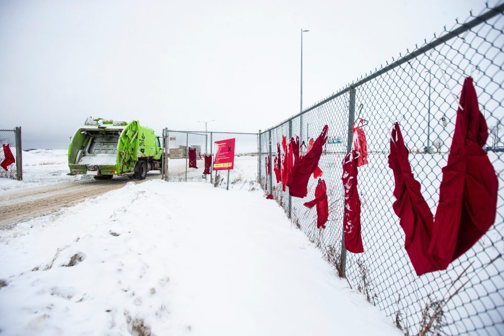 MIKAELA MACKENZIE / WINNIPEG FREE PRESS
Red dresses hang outside of the Brady landfill in Winnipeg on Thursday.