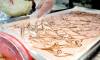 Cadorath swirls her candy bark. (Ruth Bonneville / Winnipeg Free Press)