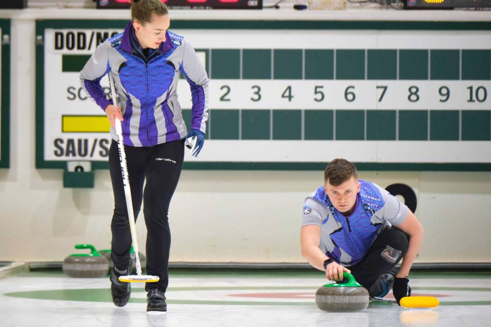 Jennifer Dodds (left) and Bruce Mouat play against Bobbie Sauder and Aaron Sluchinski in the Winnipeg Open - Mixed Doubles Curling Super Series at the Fort Rouge Curling Club on Friday. (Mike Deal / Winnipeg Free Press)