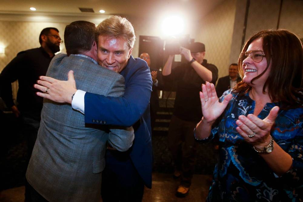 JOHN WOODS / WINNIPEG FREE PRESS
Supporters congratulate Klein after his win at party headquarters Tuesday.