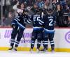 FRED GREENSLADE / THE CANADIAN PRESS FILES
                                Winnipeg Jets&rsquo; Blake Wheeler (26) celebrates his goal against the Colorado Avalanche with Mark Scheifele (55) and Dylan Demelo (2) during second period NHL action in Winnipeg last month.