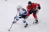 Winnipeg Jets center Cole Perfetti (91) controls the puck past Chicago Blackhawks center Colin Blackwell during the second period of an NHL hockey game in Chicago, Friday, Dec. 9, 2022. (AP Photo/Nam Y. Huh)