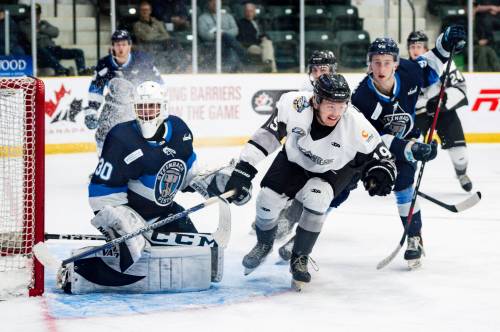 Erica Perreaux / Hockey Canada Images
                                Steinbach Pistons goalie Dominik Wasik and Battlefords North Stars forward Bradley Blake follow the puck Tuesday night in Portage la Prairie.